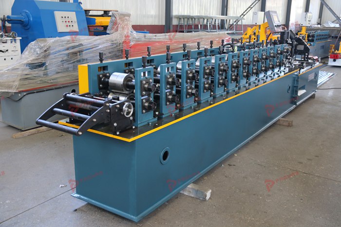 Metal stud manufacturing line with forming and cutting equipment for drywall C studs